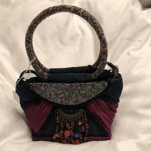 Unique silk handbag with beaded handles